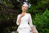 thumbnail: 'Kate' two-piece, €550;  embellished headpiece with birdcage veiling, €210,  Caithriona King; Miss KG white 'snakeskin' shoes, €95,  BT2