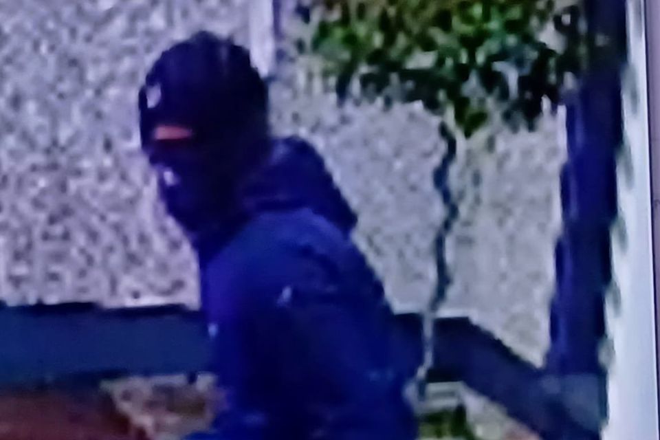 The second suspect seen running from the property.