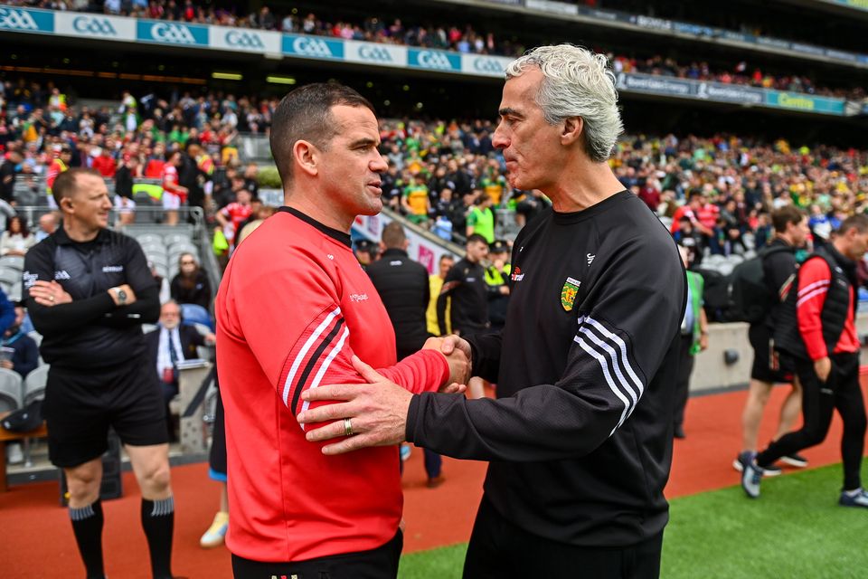 Donegal manager Jim McGuinness (right) and Louth manager Ger Brennan shake hands after their 2024 All-Ireland SFC quarter-final at Croke Park. Photo: Ben McShane/Sportsfile