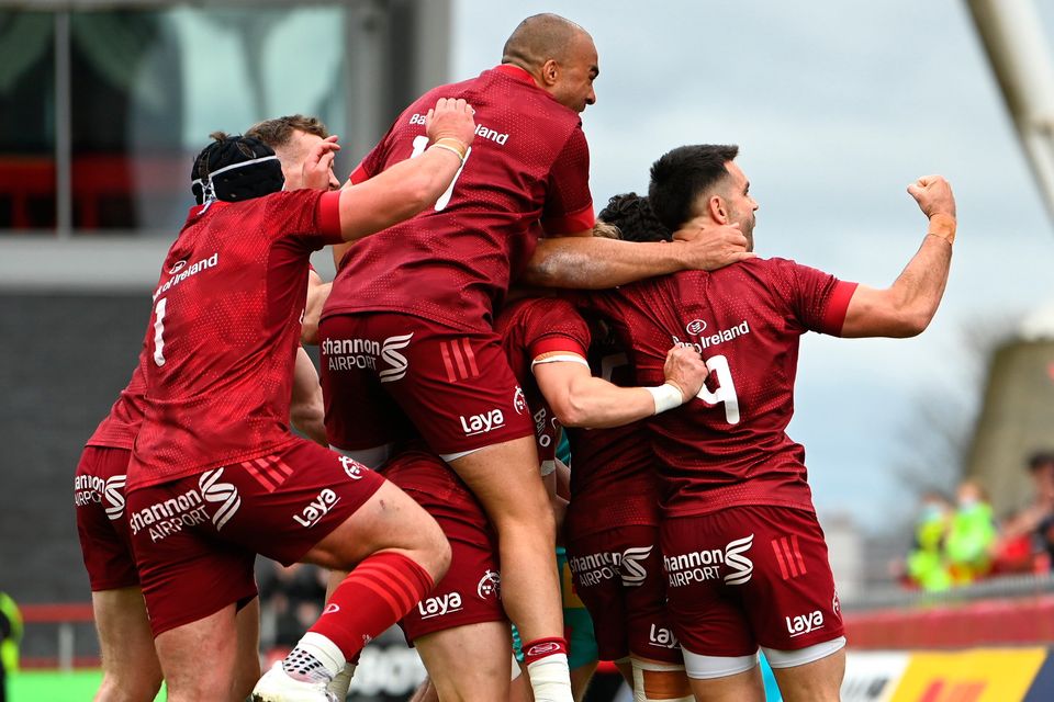 Munster players, including Conor Murray, right, celebrate their side's first try during the Heineken Champions Cup Round of 16 second leg against Exeter Chiefs at Thomond Park in Limerick. Photo: Harry Murphy/Sportsfile