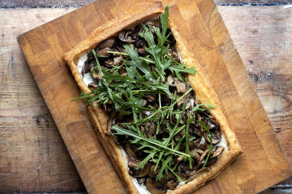 "I like to bake the puff pastry tart in an upturned baking tray so that when it’s baked, it’s really easy to slide off on to a serving board or plate!" Photo: Tony Gavin