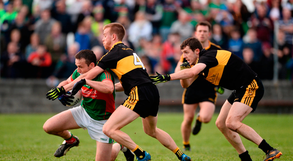 Peter O'Dwyer of Kilmurry Ibrickane in action against Fionn Fitzgerald and Michael Moloney of Dr Crokes