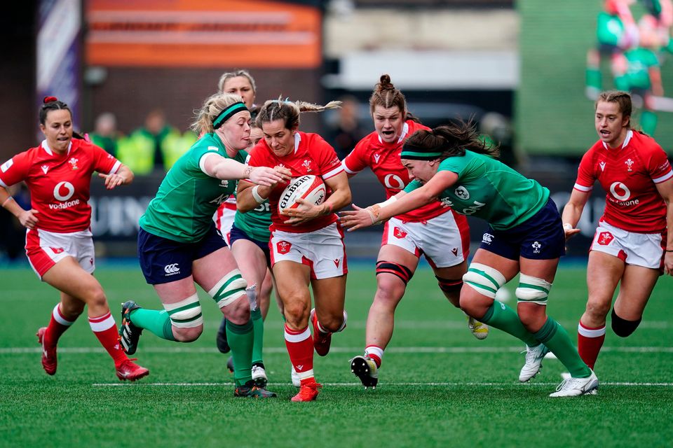 Wales' Kerin Lake (centre) is tackled by Ireland's Sam Monaghan (left) during the TikTok Women's Six Nations match at Cardiff Arms Park, Cardiff