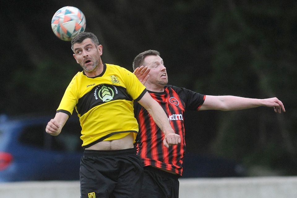 Carrick Rovers' Bernard McSkane and Seán McEvoy, Bellurgan United, challenge for the ball during the NEFL Premier Division game at Flynn Park. Picture: Aidan Dullaghan/Newspics