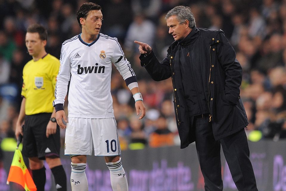 MADRID, SPAIN - DECEMBER 16:  Real Madrid CF head coach Jose Mourinho talks with Mesut Ozil of Real Madrid during the La Liga match between Real Madrid CF and RCD Espanyol at estadio Santiago Bernabeu on December 16, 2012 in Madrid, Spain.  (Photo by Denis Doyle/Getty Images)