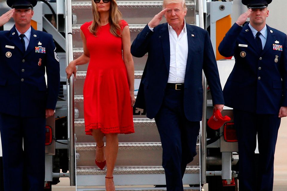 U.S. President Donald Trump and first lady Melania Trump step from Air Force One to attend a "Make America Great Again" rally at Orlando-Melbourne International Airport in Melbourne, Florida, U.S. February 18, 2017.  REUTERS/Kevin Lamarque
