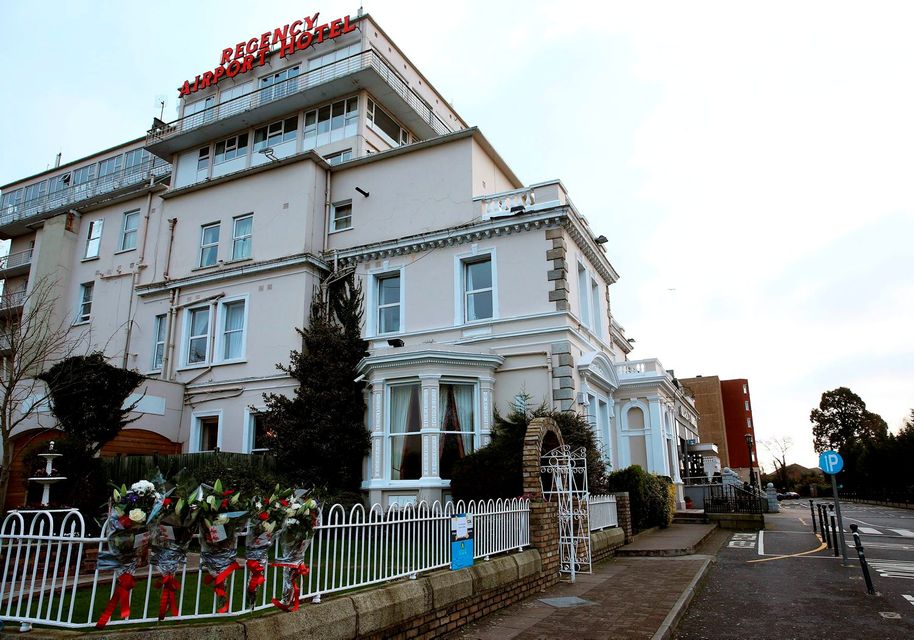 Flowers left outside the Regency Hotel in Dublin after one man died and two others were injured following a shooting incident at the hotel where a weigh-in for a boxing match was taking place