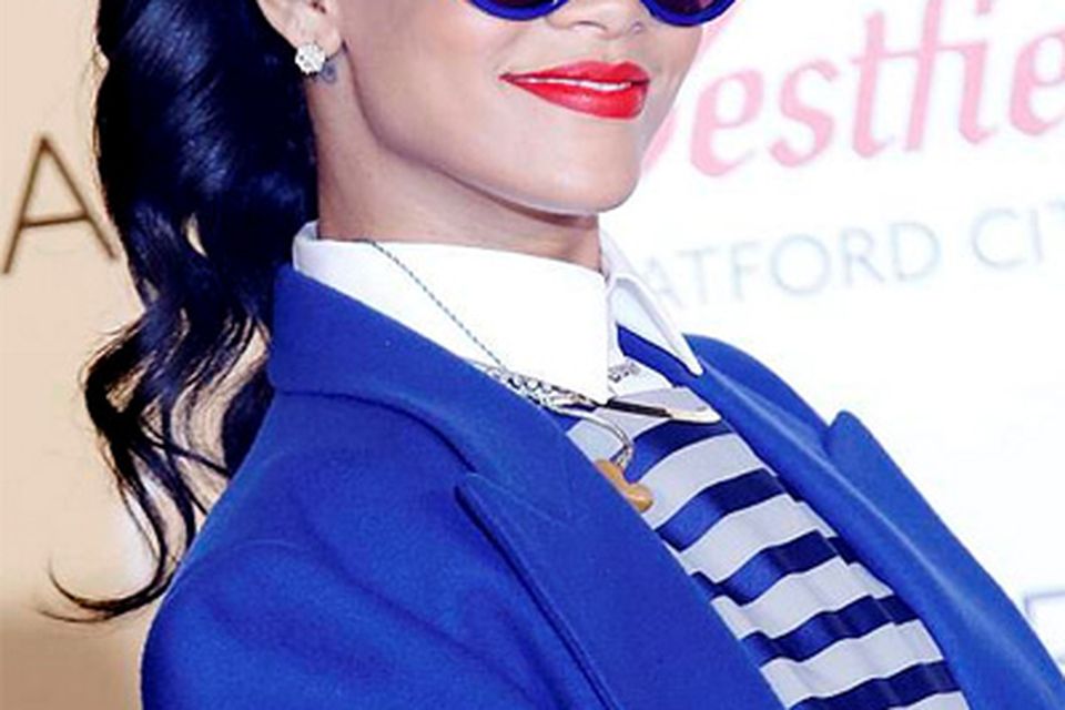 Rihanna rocks an androgynous look turning on Christmas lights in London