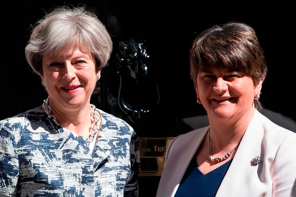 Britain's Prime Minister, Theresa May (L), greets Arlene Foster, the leader of Northern Ireland's Democratic Unionist Party at 10 Downing Street, London. Photo: GETTY