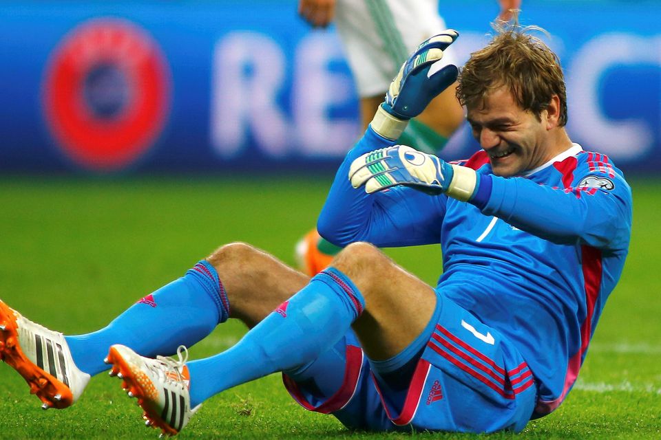Northern Ireland's goalkeeper Roy Carroll reacts after a collision with Romania's Alexandru Chipciu (not pictured) last night