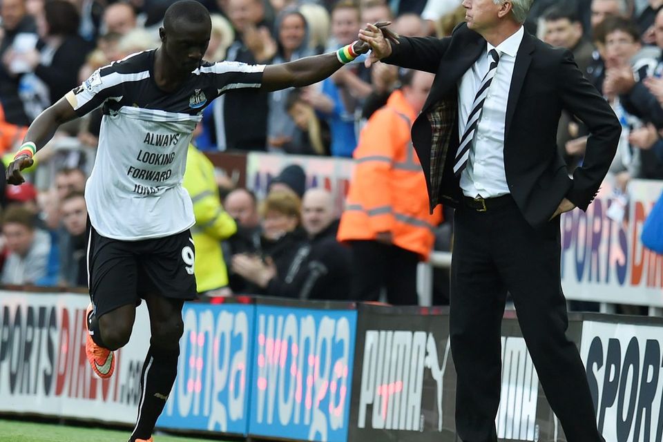 Newcastle's Papiss Cisse celebrates his goal with manager Alan Pardew. Photo credit: Owen Humphreys/PA Wire