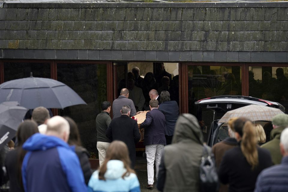 The three coffins enter St Eunan’s Church in Raphoe, Co Donegal (Niall Carson/PA)