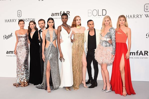 (L-R) Irina Shayk, Bianca Balti, Pierre Emmanuel Angeloglou, Neelam Gill, Maria Borges, Alexina Graham, Olivier Rousteing, Lara Stone and Doutzen Kroes arrives at the amfAR Gala Cannes 2017 at Hotel du Cap-Eden-Roc on May 25, 2017 in Cap d'Antibes, France.  (Photo by Stephane Cardinale - Corbis/Corbis via Getty Images)