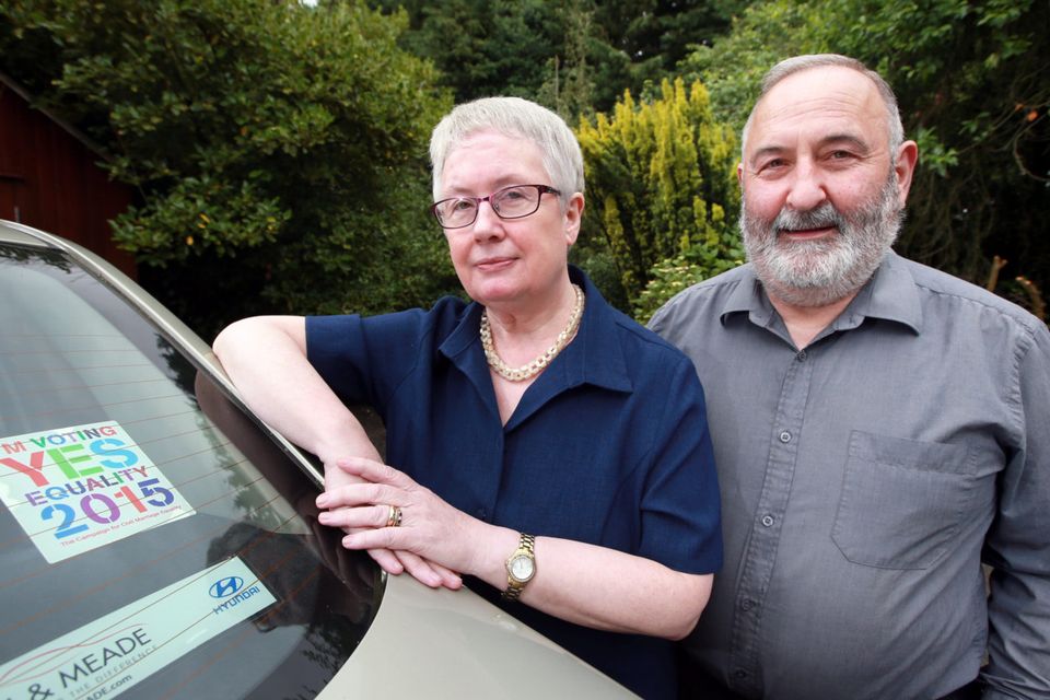 Lucy and John Keaveney pictured with YES Equality car sticker which they were asked to remove because the car was parked in the grounds of a church.