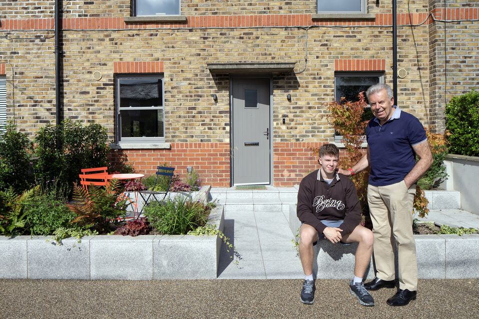 Eugene and his son Alex outside the newly renovated house. There’s a resin driveway to the front with two electric car sockets. Nearer the house is a patio with planting by Róisín Sweeney of Nettle Design and furniture from local company Formality at The Cowshed. Photo: Tony Gavin
