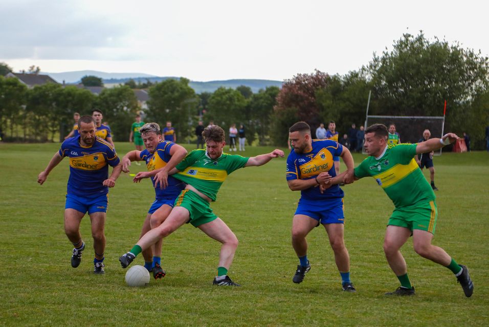 Players from Carnew Emmets and Annacurra tussle for possession during the Liam Cullen Cup semi-final on Tuesday evening.