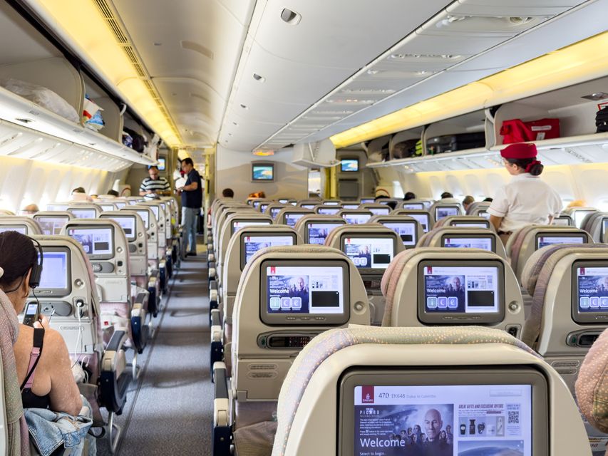 The older economy class cabin on an Emirates Boeing 777-300ER, with smaller screens. Photo: Getty