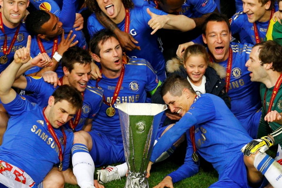 Porto players celebrate as they lift the trophy after beating