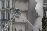 thumbnail: Firemen try to extinguish a fire in a collapsed building in Liege, in Belgium (AP)