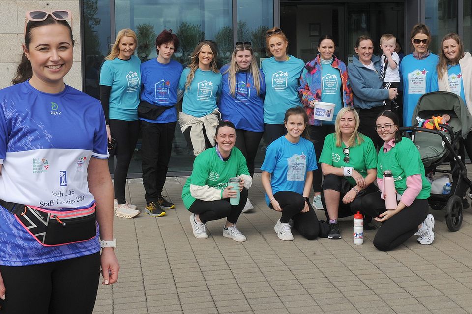 Staff in Irish Life, Dundalk with Paige Gernon (left) who took part in a fundraising walk at Irish Life in aid of the Down Syndrome Centre, North East and The Irish Motor Neurone Disease Association (IMNDA). Photo: Aidan Dullaghan/Newspics
