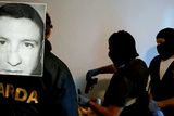 thumbnail: Spanish police and gardai with the handgun they seized; inset left, James Quinn