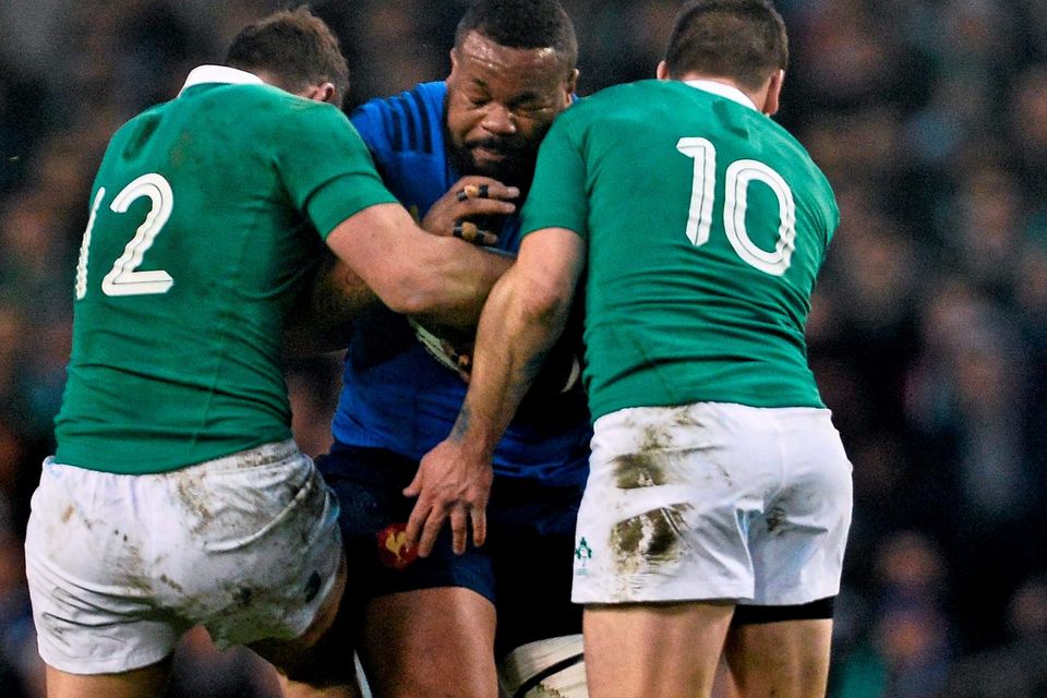 Robbie Henshaw (left) and Jonathan Sexton attempt to halt France’s midfield colossus Mathieu Bastareaud
