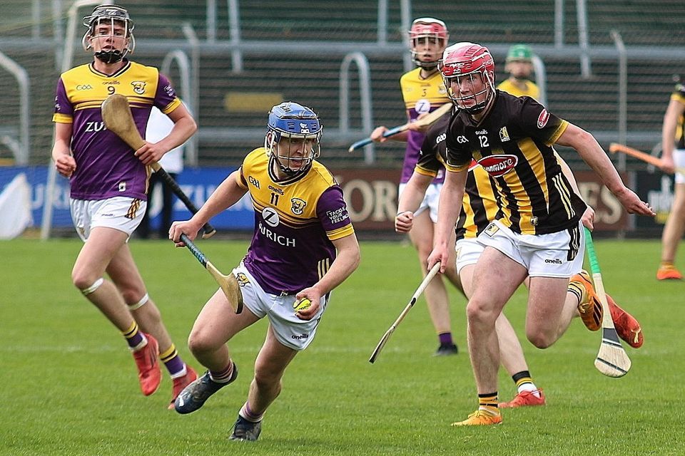 Wexford captain Jack Dunne getting away from Jake Mullen of Kilkenny. Photo: P.J. Howlin