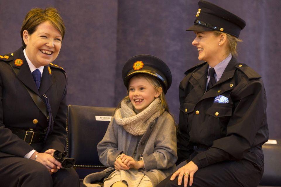 Eva Counihan (8) gets to wear Garda Commissioner, Noirin O'Sullivan's cap her mum Leonora Power