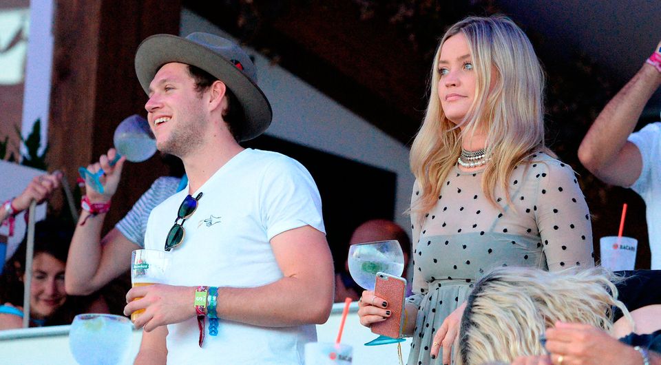 Niall Horan and Laura Whitmore enjoy the atmosphere as they listen to  Tom Petty perform as they attend the Barclaycard Exclusive British Summer Time Festival at Hyde Park on July 9, 2017 in London, England.  (Photo by Eamonn M. McCormack/Getty Images for Barclaycard)
