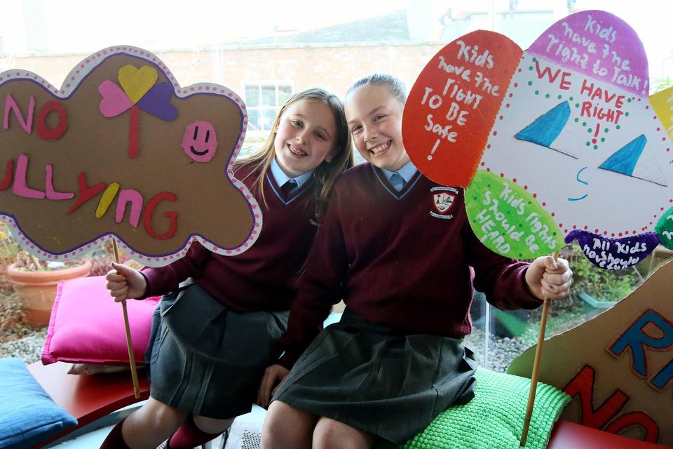 Penni McCarthy (10) and Layla McCarthy (11) showing off their banners for the children’s rights rally in Meeting House Square on February 24. Pic: Mark Stedman