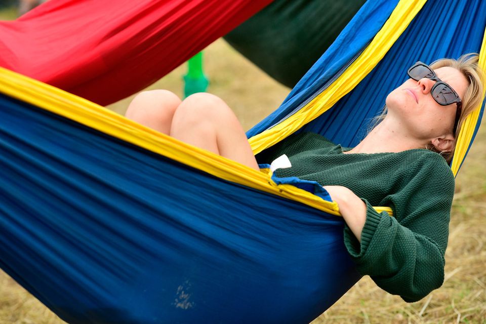 Festival-goers relax in hammocks during day one of Glastonbury Festival at Worthy Farm, Pilton on June 26, 2019 in Glastonbury, England. (Photo by Leon Neal/Getty Images)