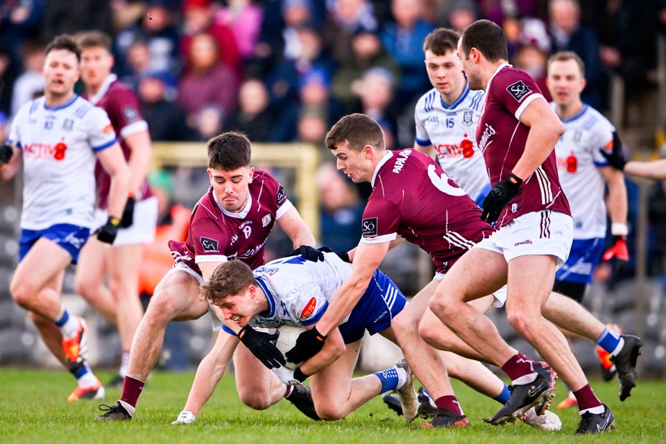 Michael Hamill of Monaghan is tackled by Galway players, from left, Seán Kelly, John Daly and John Maher