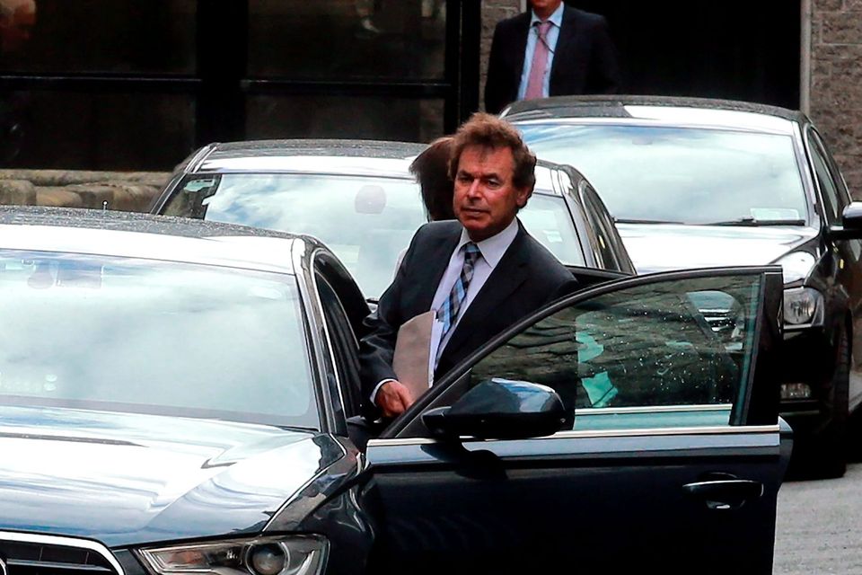 Alan Shatter leaves Leinster House after resigning as Justice Minister in May 2014. Photo: Arthur Carron