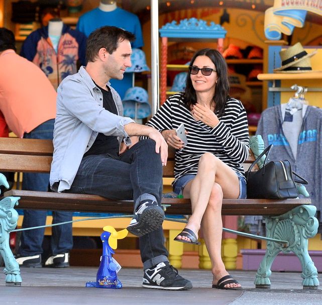 Courteney Cox and her fiance Johnny McDaid spend a day at Disneyland with Courteney's daughter Coco.