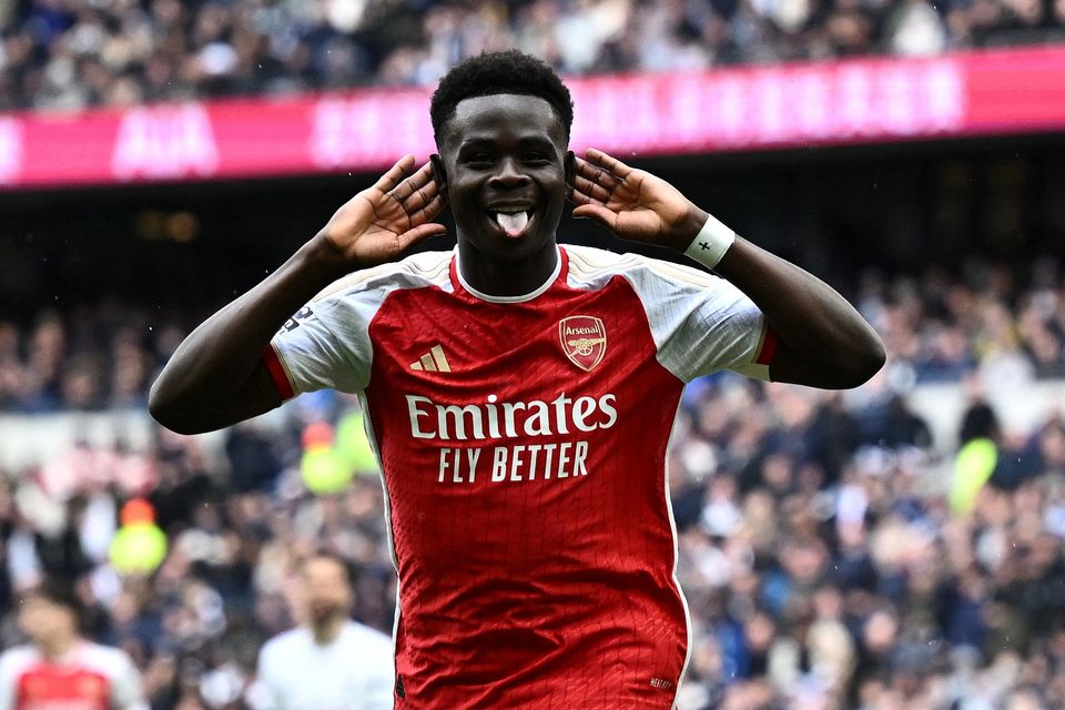 Arsenal's Bukayo Saka celebrates scoring their second goal against Tottenham