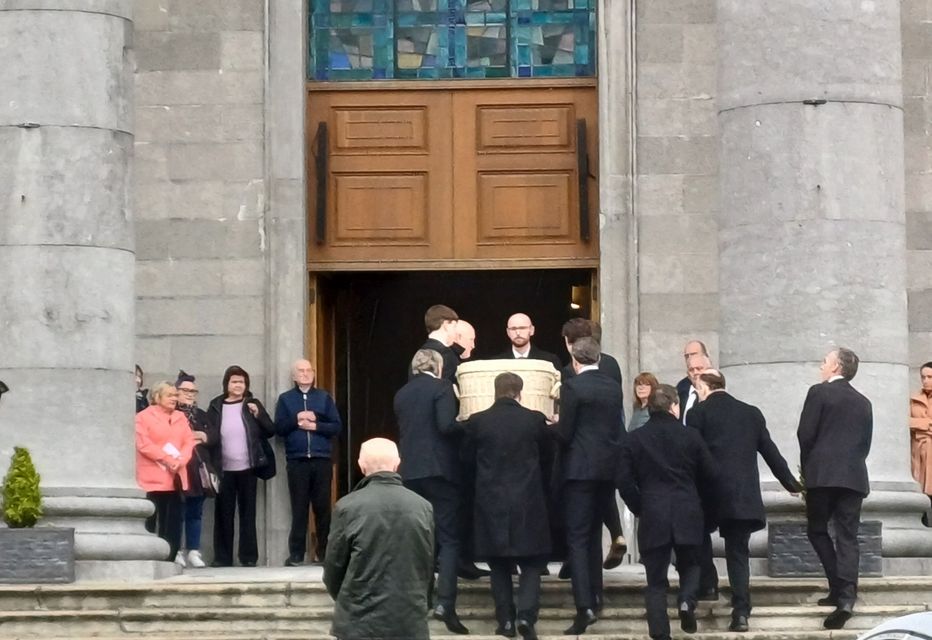 The remains of the late Sarah McNally are carried into St Mel's Cathedral.