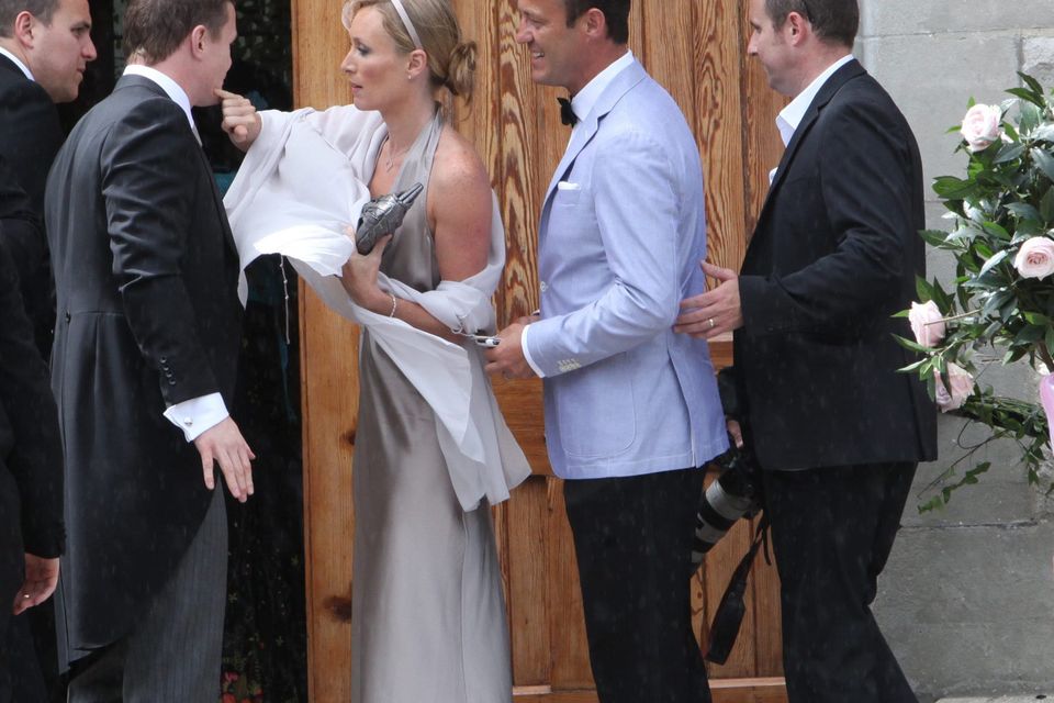 Victoria Smurfit and Doug Baxter with rugby star Brian O’Driscoll at his wedding to Amy Huberman. Photo: Gareth Chaney
