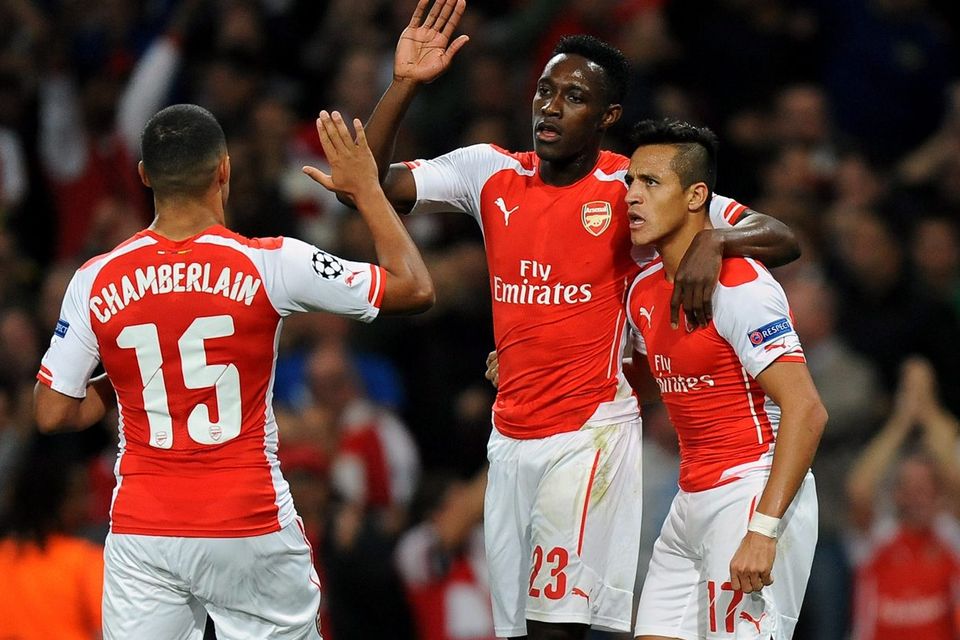 Danny Welbeck celebrates with Alexis Sanchez and Alex Oxlade-Chamberlain after opening the scoring for Arsenal in their Champions League game against Galatasaray at the Emirates. Photo: Andrew Matthews/PA Wire