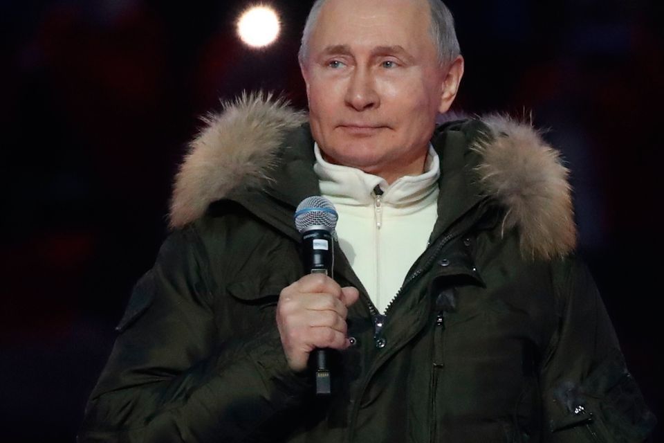 Russian President Vladimir Putin speaks prior to a concert marking the seventh anniversary of the referendum on the state status of Crimea and Sevastopol and its reunification with Russia, in Moscow, Russia, Thursday, March 18, 2021. (Vyacheslav Prokofyev, Sputnik, Kremlin Pool Photo via AP)