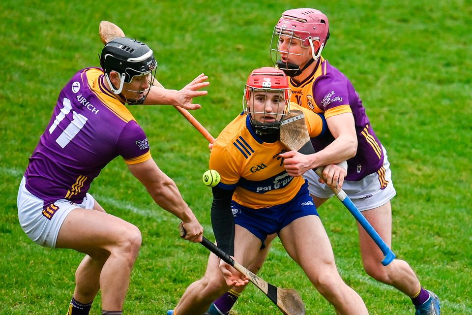 Darragh Lohan of Clare in action against Wexford players Lee Chin, left, and James Byrne at Chadwicks Wexford Park. Photo: Seb Daly/Sportsfile