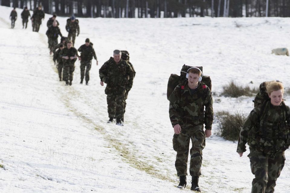In training: Defence Forces on the Curragh Plains in Co Kildare earlier this month; and above, the 55th Infantry preparing last March ahead of a UN deployment. Photo: Eamonn Farrell/RollingNews.ie
