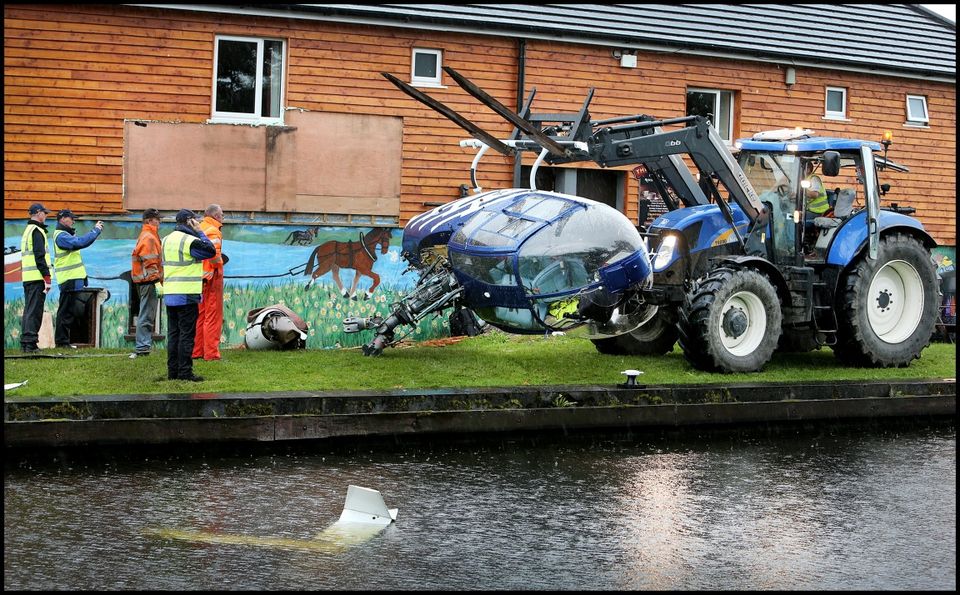 Members Irish Aviation Autority and Aviation Accident Investigation Unit removing the helicopter from the crash site at the Rustic Inn pub in Abbeyschrule Longford.
Pic Steve Humphreys
16th July 2015.