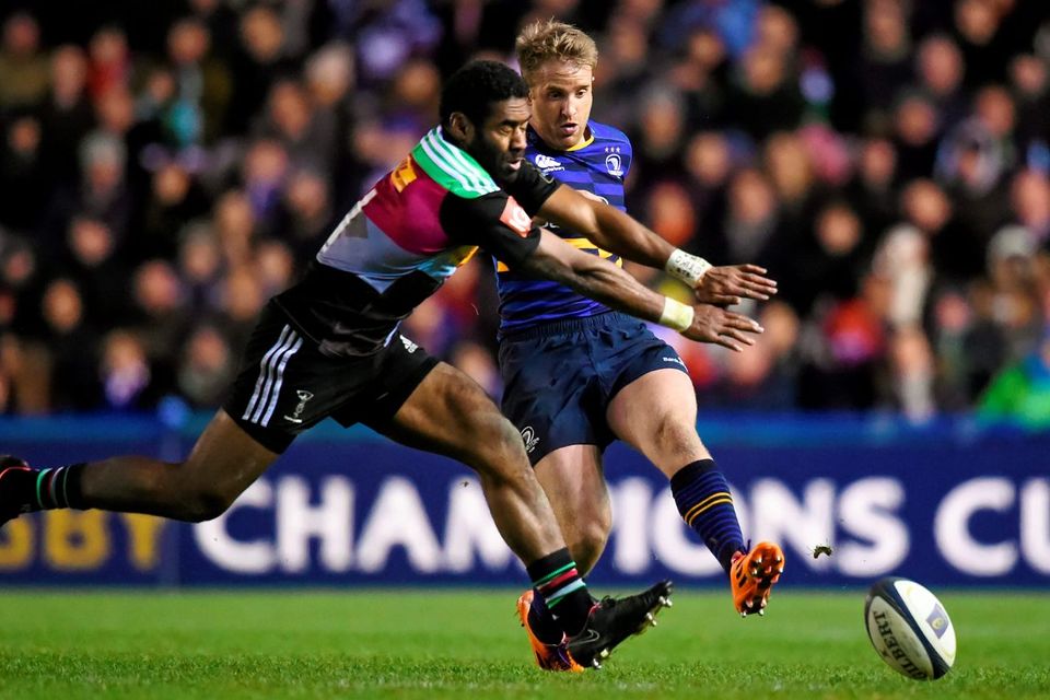 Leinster's Luke Fitzgerald kicks a grubber past Aseli Tikoirotuma of Harlequins during their European Rugby Champions Cup clash at Twickenham Stoop. Photo: Stephen McCarthy / SPORTSFILE