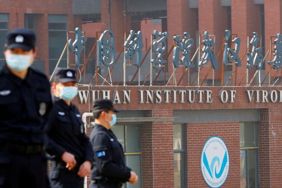 Security personnel keep watch outside the Wuhan Institute of Virology during the visit by the WHO team tasked with investigating the origins of Covid-19 in February 2021. Photo: Reuters