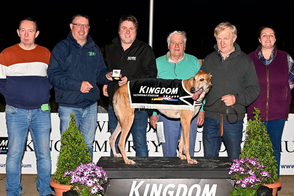KGS Racing Manager Kieran Casey, second from left, presents the winner's prize to winning owner Michael Hennessy after Outdoor Cracker won the Kingdom Stadium Novice Stake Final at the Kingdom Greyhound Stadium on Saturday. Included, from left, are Tom Condon, Declan Hennessy, trainer Liam O'Callaghan and Grainne Murphy. Photo by www.deniswalshphotography.com