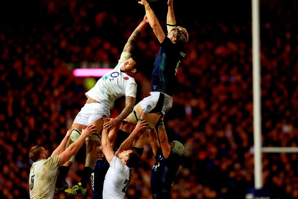 England's Courtney Lawes and Scotland's Richie Gray compete for a line out ball. Photo: PA