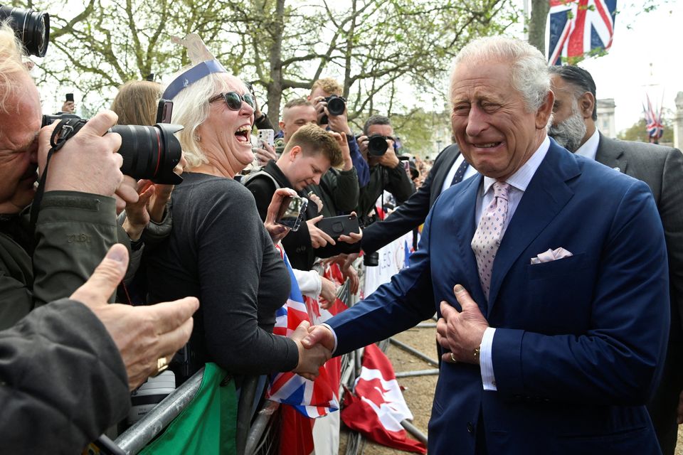 Britain's King Charles reacts as he meets well-wishers during a walkabout on the Mall outside Buckingham Palace ahead of his and Camilla, Queen Consort's coronation, in London, Britain, May 5, 2023. REUTERS/Toby Melville/Pool