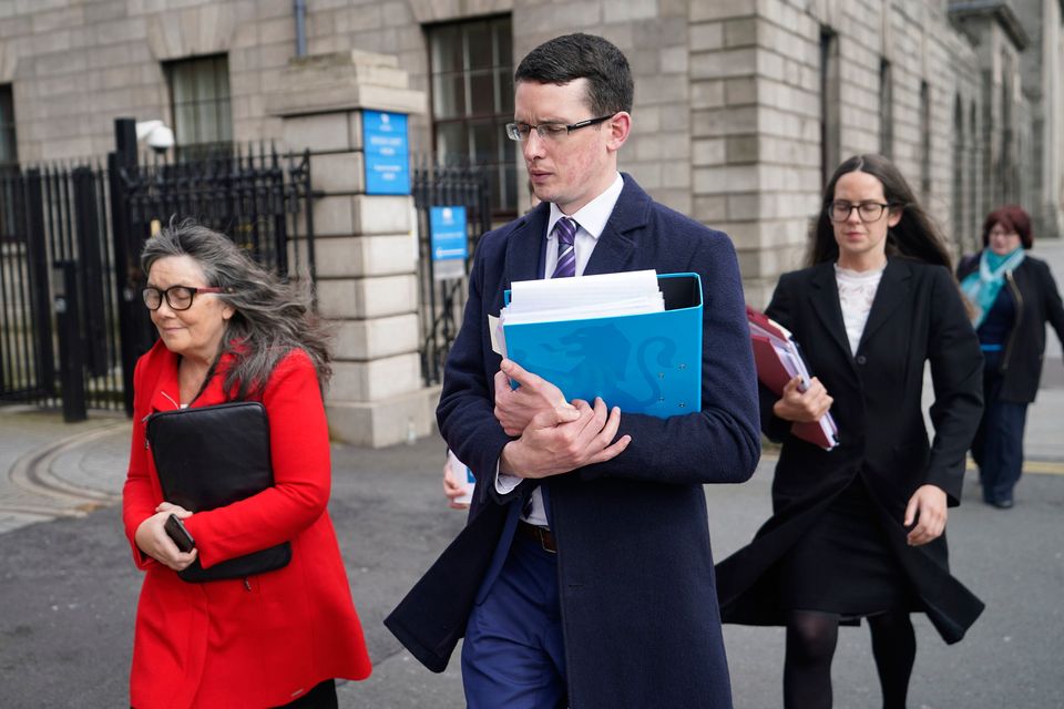 Teacher Enoch Burke, with his mother Martina Burke (left) and his sister Ammi Burke leaving the High Court in Dublin. Photo: PA