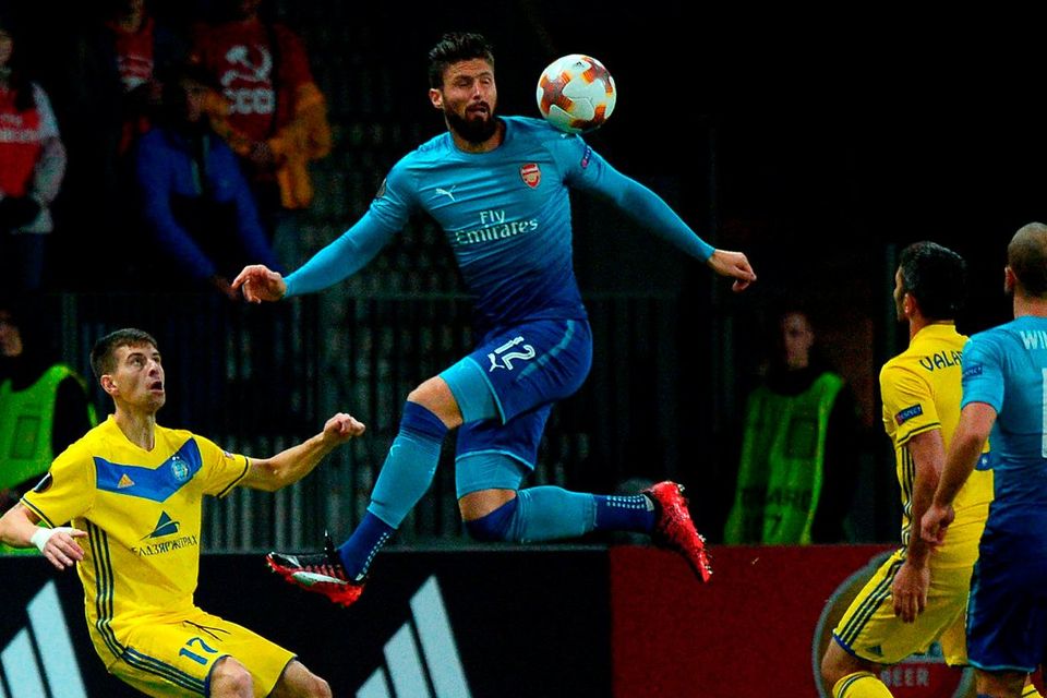 Olivier Giroud goes head and shoulders above the BATE Borisov defence in Minsk. Photo: Maxim Malinovsky/AFP/Getty Images