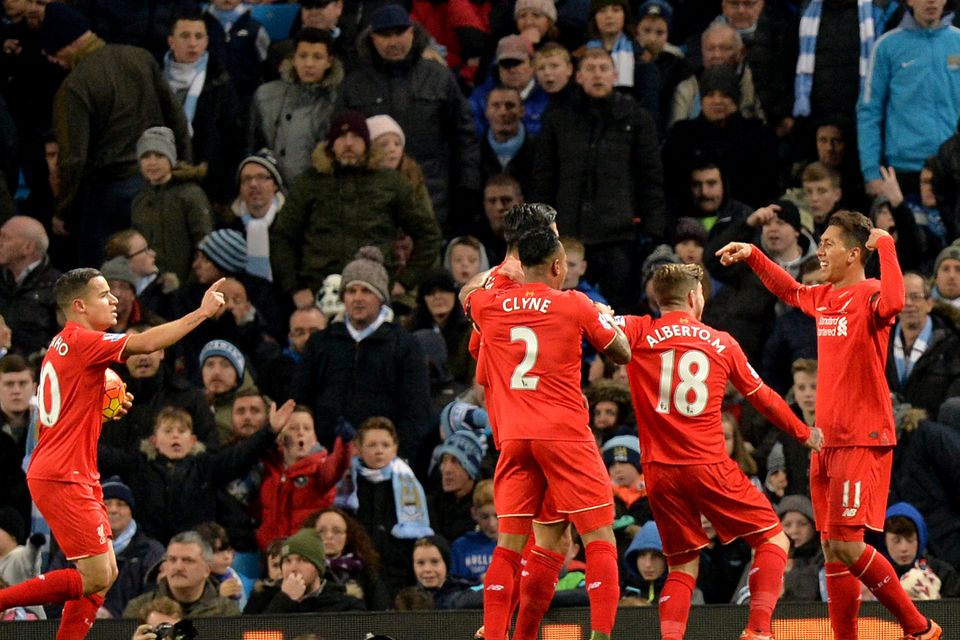 Liverpool's Roberto Firmino, far right, celebrates his goal against City in 2015